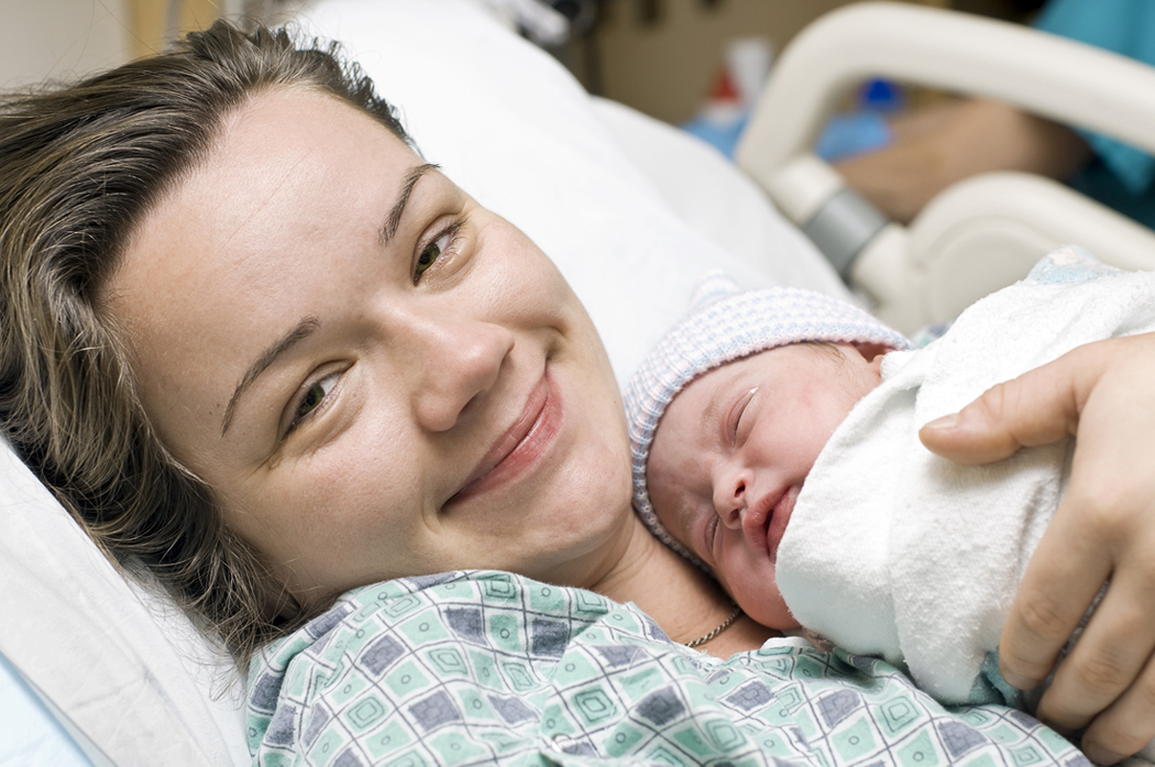 Mother holding her newborn baby