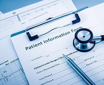 Registration form, stethoscope, and pen