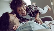 A father playing with his son